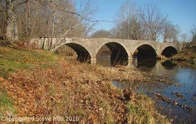Photo of a four span stone arch bridge