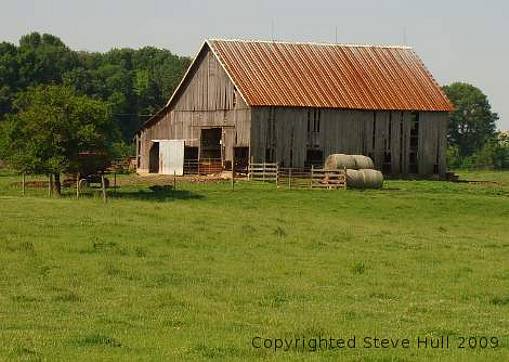 An old barn with hay bales