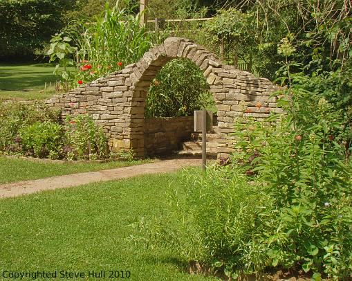 Stone arch entrance to pioneer garden